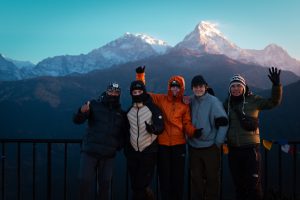 Trekkers enjoying the beautiful mountain view at Poon Hill during sunrise. Ghoreapani Poon Hill Trek is among the best easy treks in Nepal.