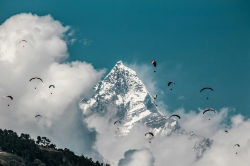 Amazing paragliders with Machhapuchhre in the backdrop